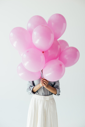 Woman Holding Pink Balloons