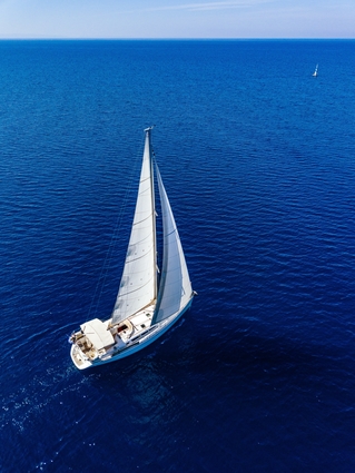 Sailboat In The Middle Of The Ocean